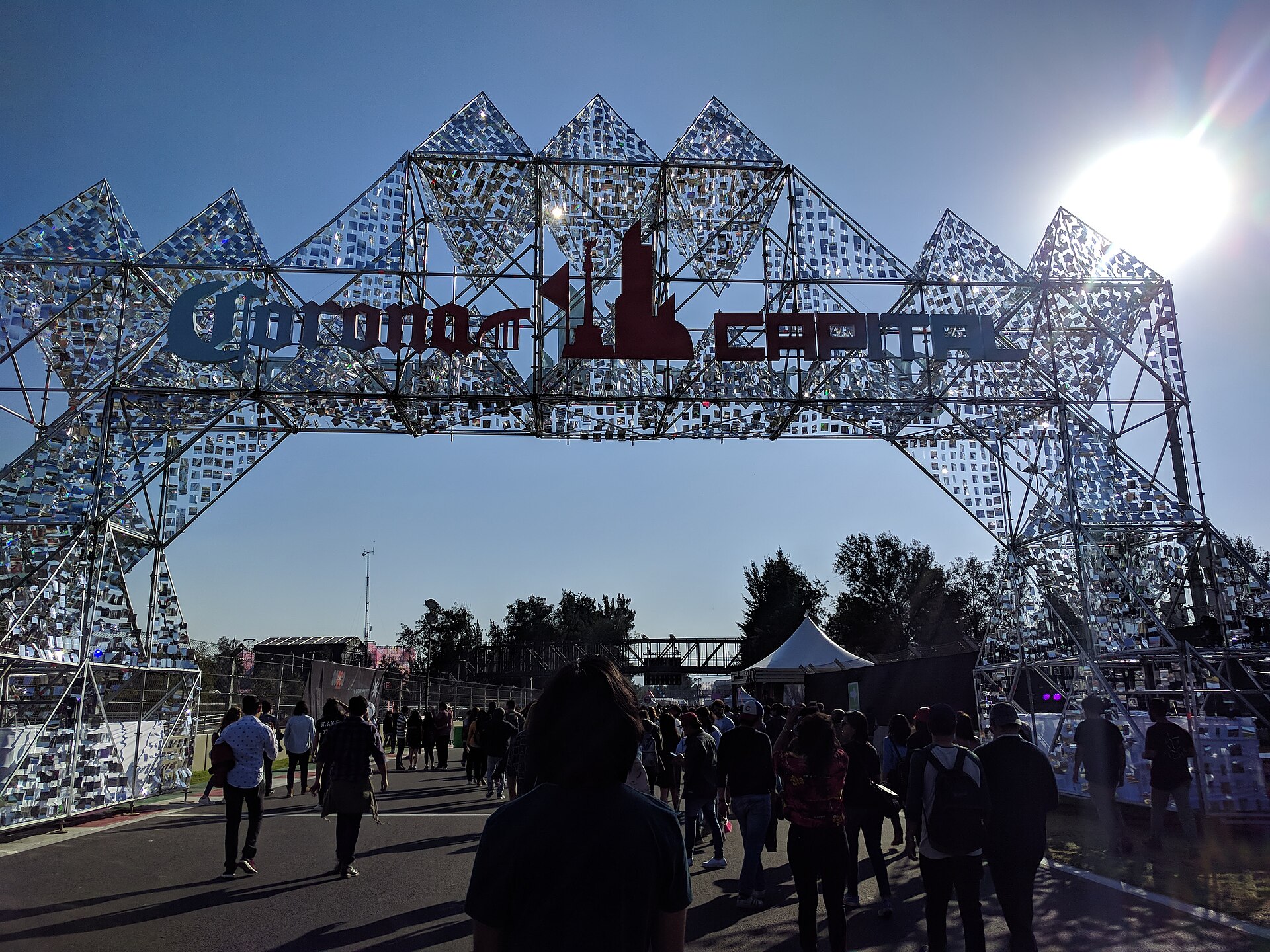 Festival entrance gate and queue outside the Autódromo Hermanos Rodríguez on Avenida Añil