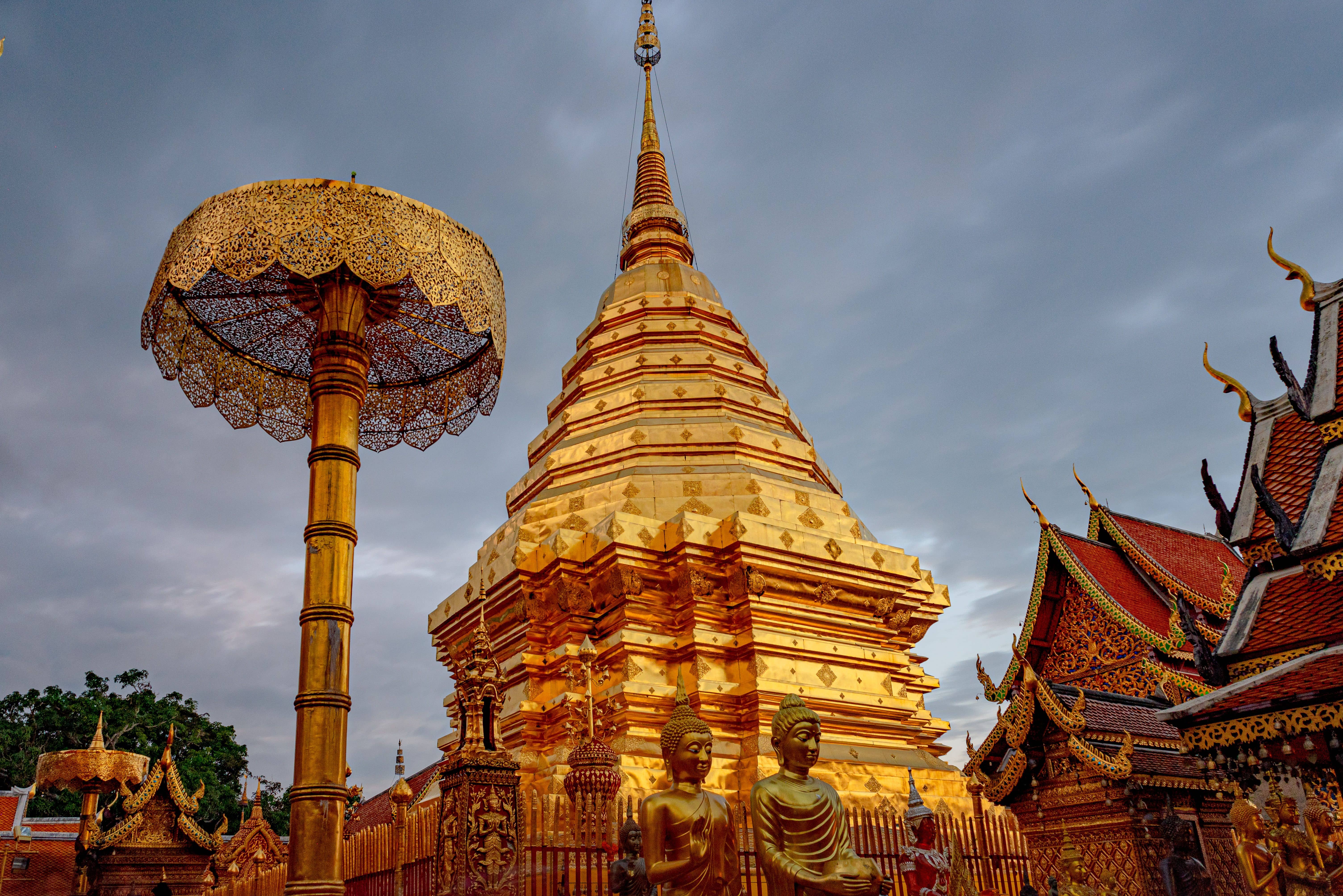 The golden chedi of Wat Phra That Doi Suthep above Chiang Mai with the city visible far below