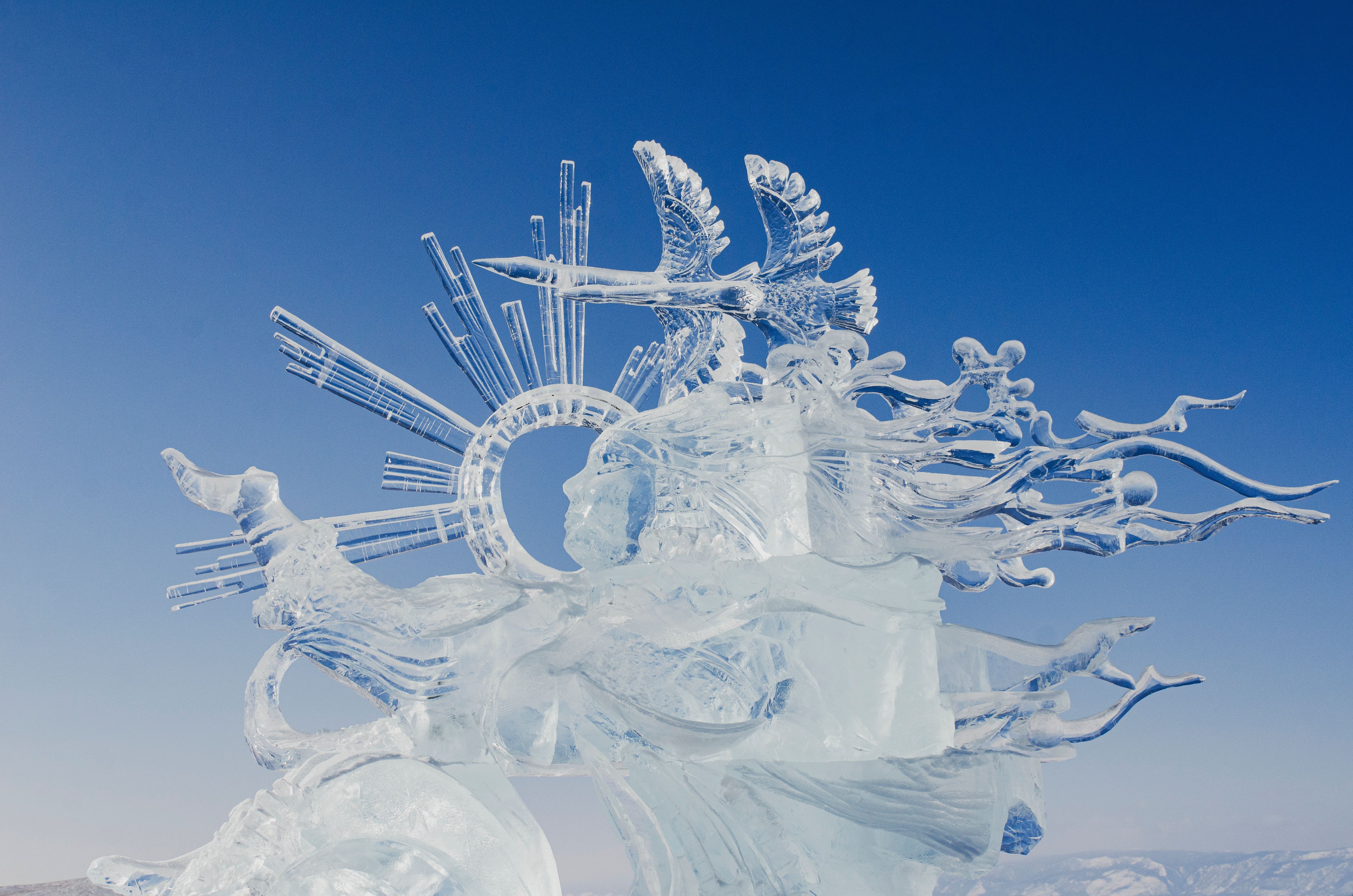 Fireworks bursting over the lit ice castles of Harbin Ice and Snow World on the festival's opening night