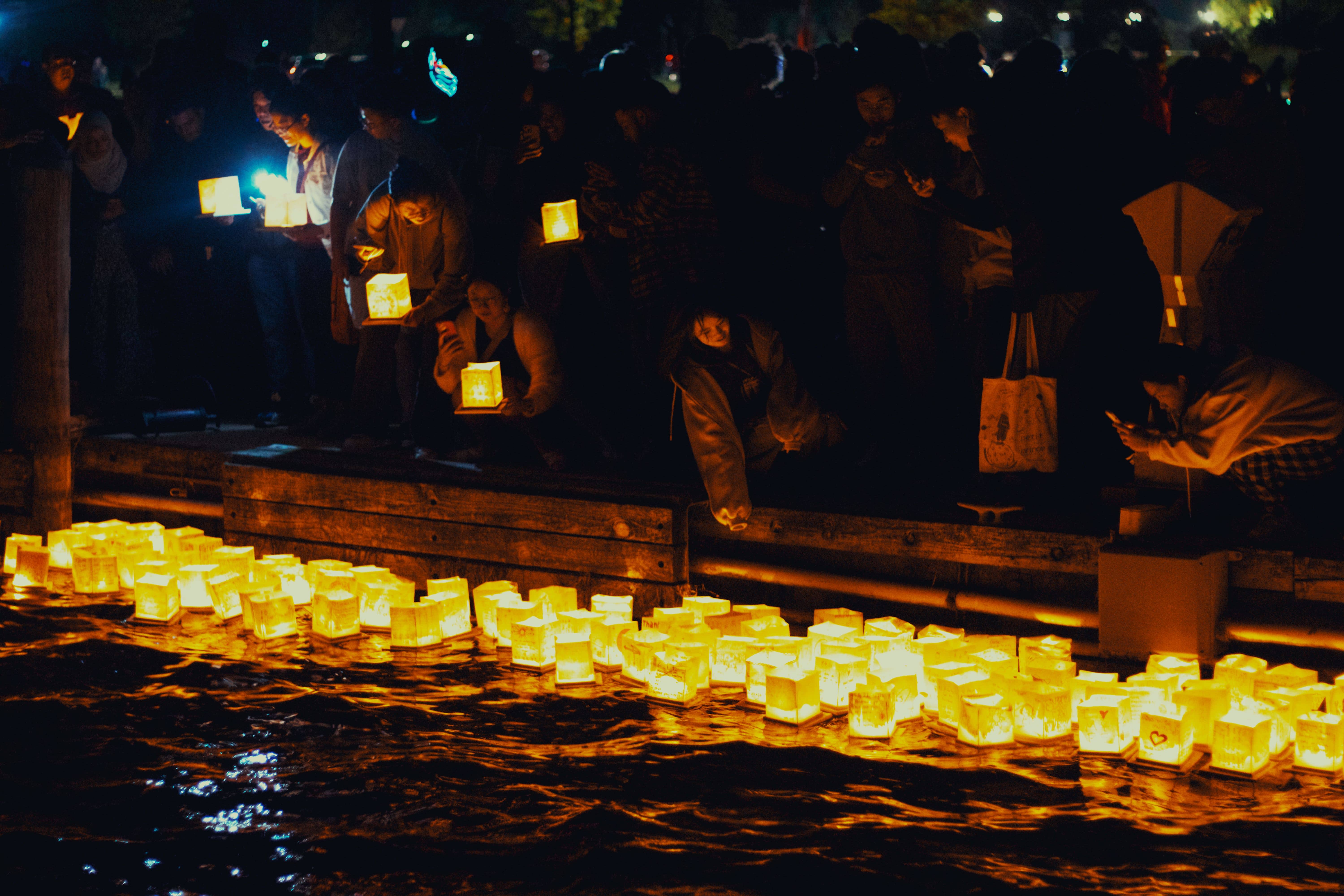 The giant burning "dai" character of the Daimonji bonfire glowing on the hillside above Kyoto at night during Gozan no Okuribi
