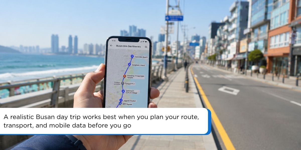 Traveler checking a Busan one day itinerary map on phone before exploring the city