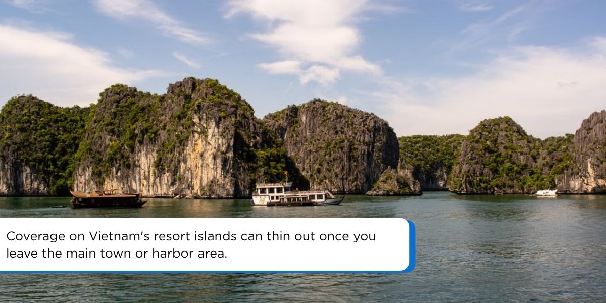 Limestone cliffs and boats in Ha Long Bay, Vietnam Caption: Coverage on Vietnam's resort islands can thin out once you leave the main town or harbor area.