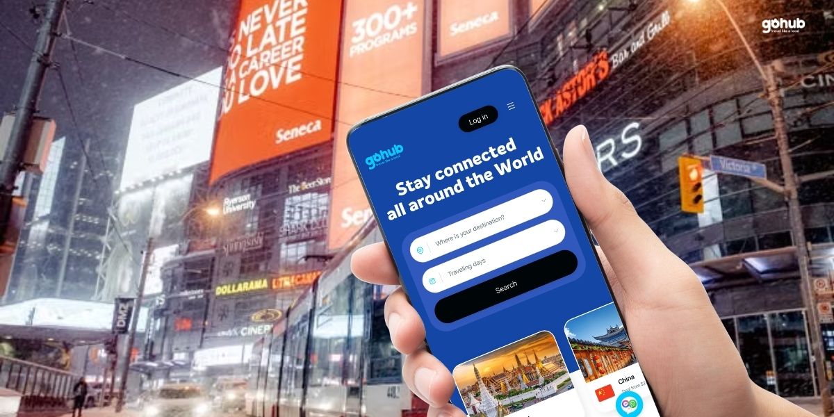 A traveler holding a smartphone showing an eSIM app