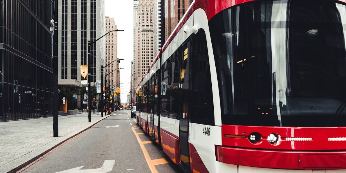 A red-and-white streetcar in downtown Toronto, part of the city's transit network