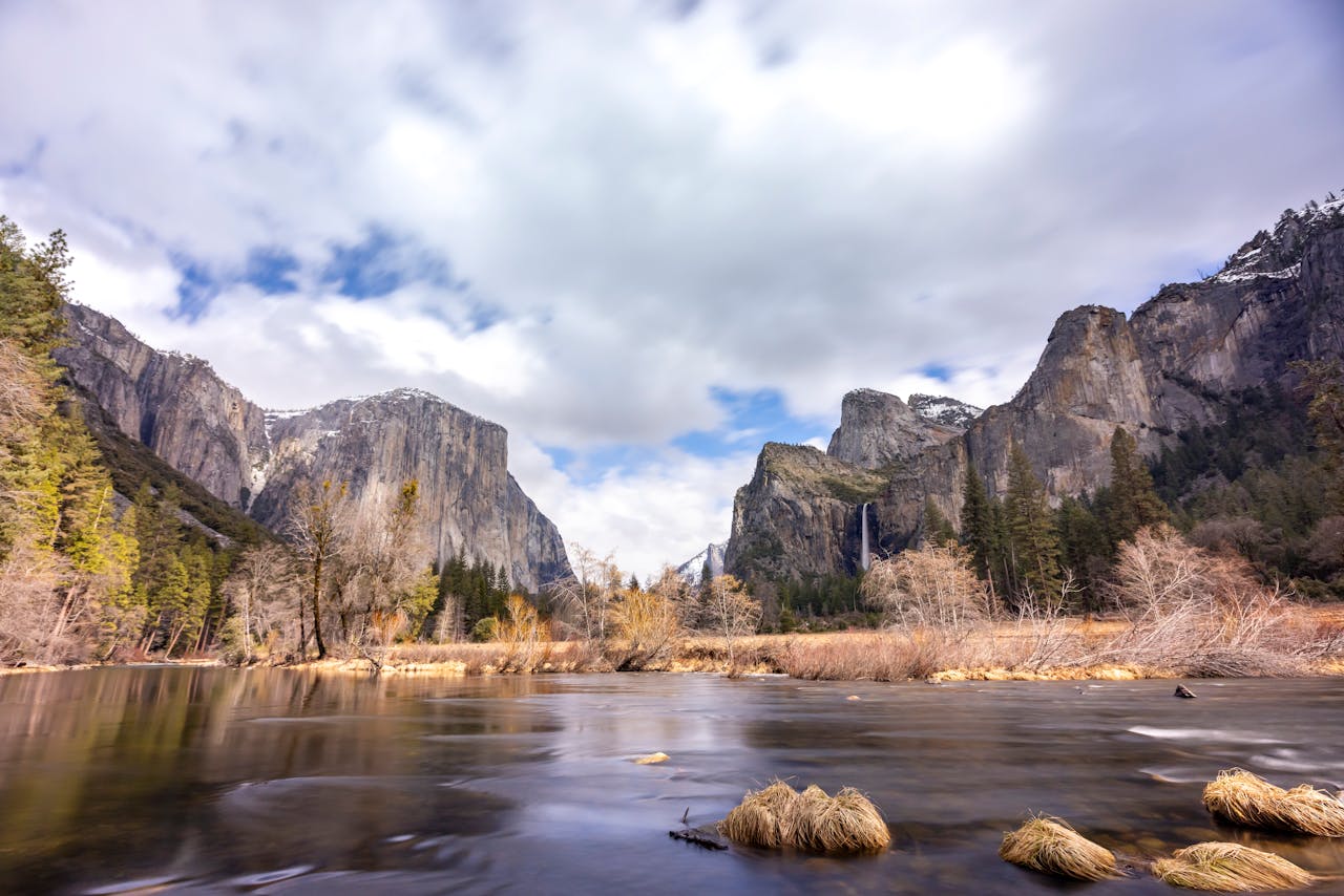 Yosemite Valley with granite cliffs, waterfall and river in Yosemite National Park