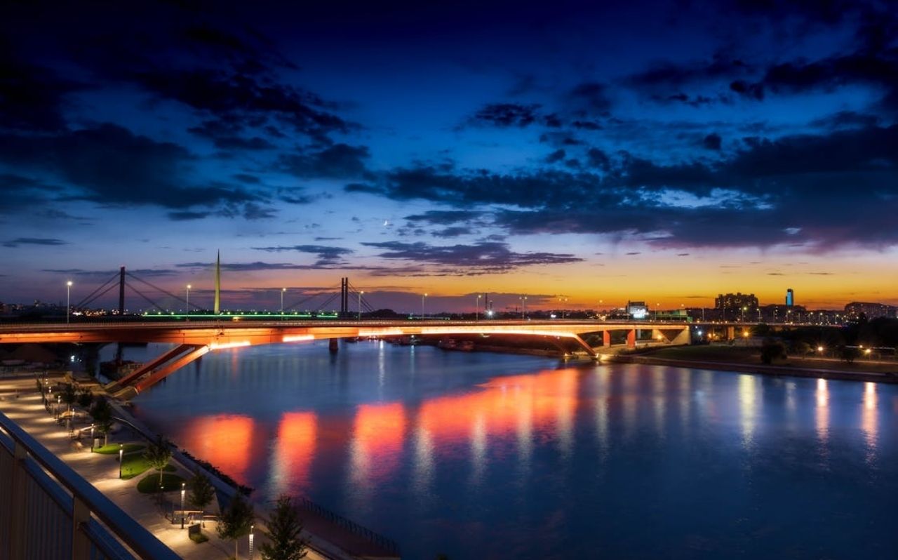 Belgrade city center at night with illuminated streets and pedestrian activity