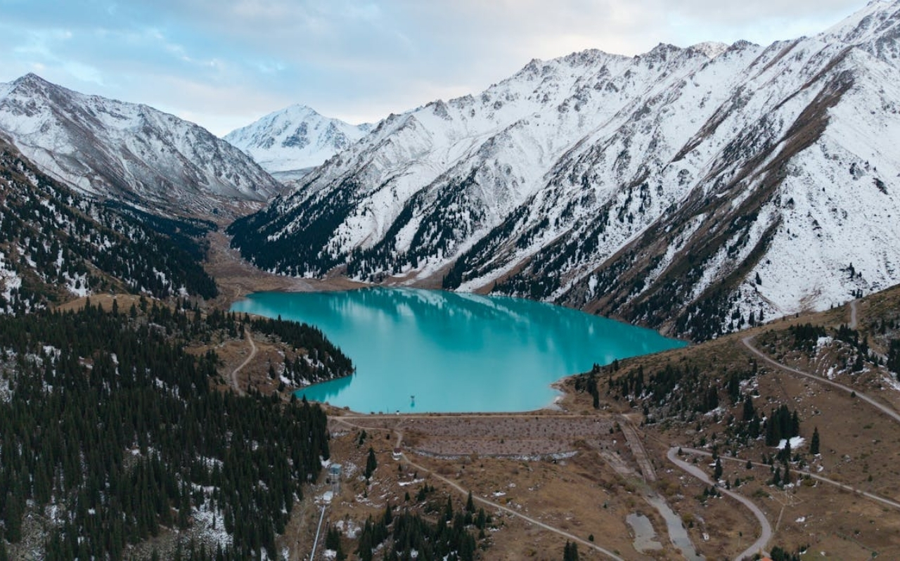 Big Almaty Lake with turquoise water surrounded by mountains near Almaty
