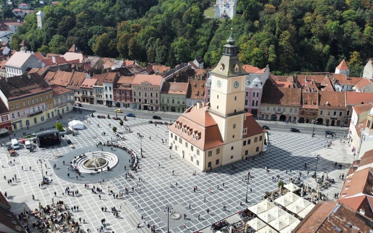 Council Square in Brasov Romania surrounded by colorful historic buildings