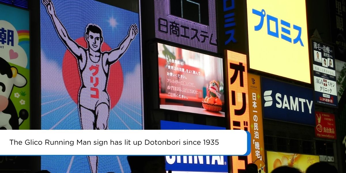 dotonbori osaka glico running man sign canal reflection at night