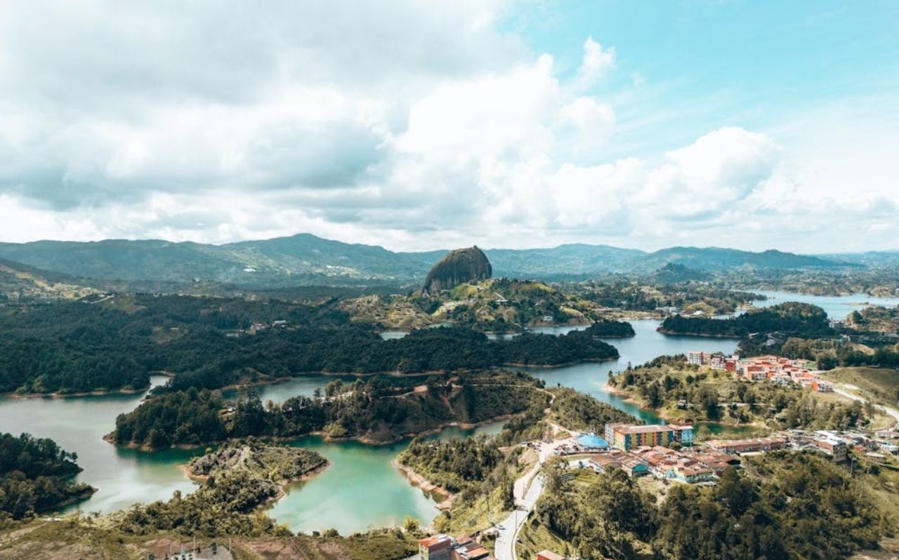 Colorful buildings in Guatapé and Piedra del Peñol rock