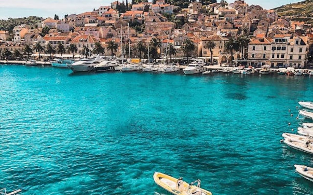 Hvar Island Croatia harbor with boats and stone buildings