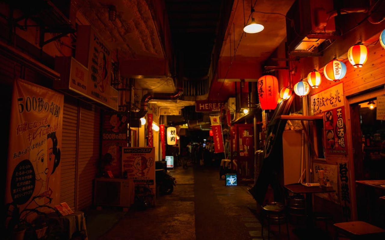 Night street in Naha Okinawa with glowing lanterns and restaurants