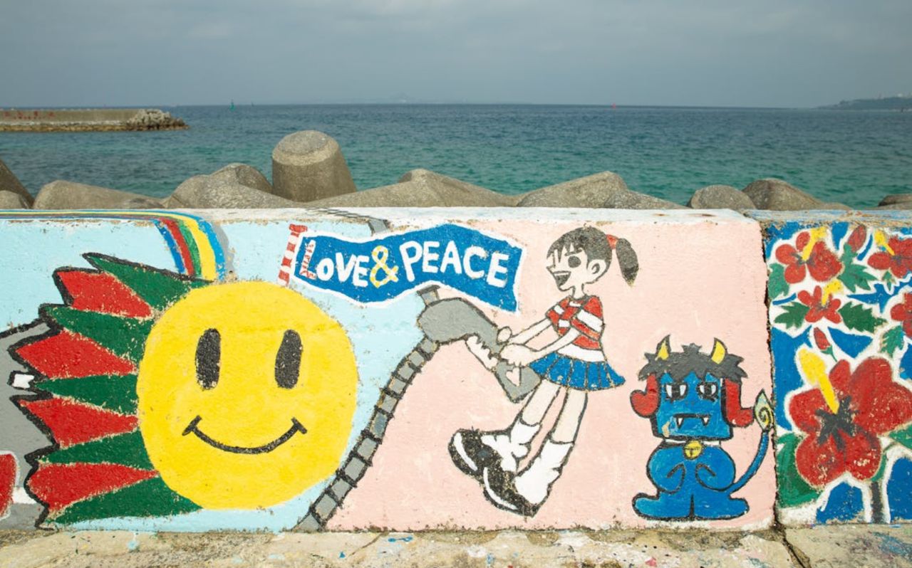 Colorful seaside mural along Okinawa coastal breakwater
