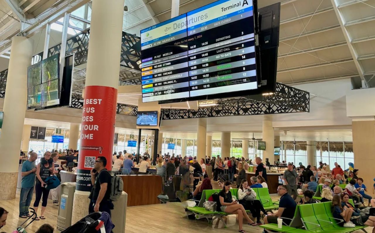 Traveler using a smartphone for navigation after arriving in Punta Cana