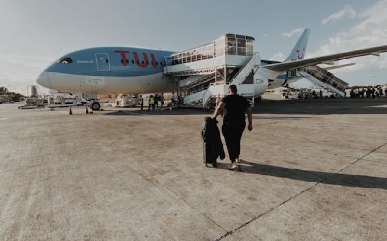 Travelers walking inside Punta Cana International Airport terminal after arrival