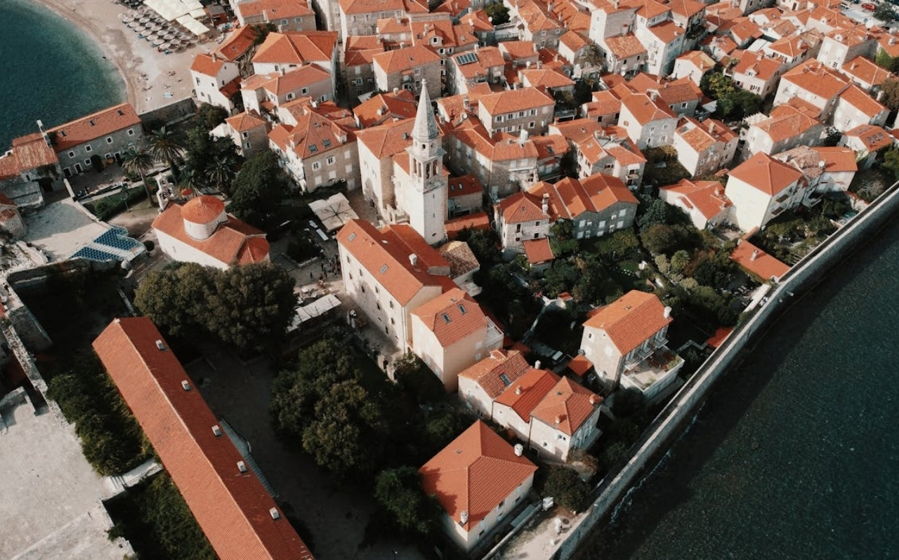 Quiet pebble beach in a small Montenegro coastal town with calm water and minimal crowds