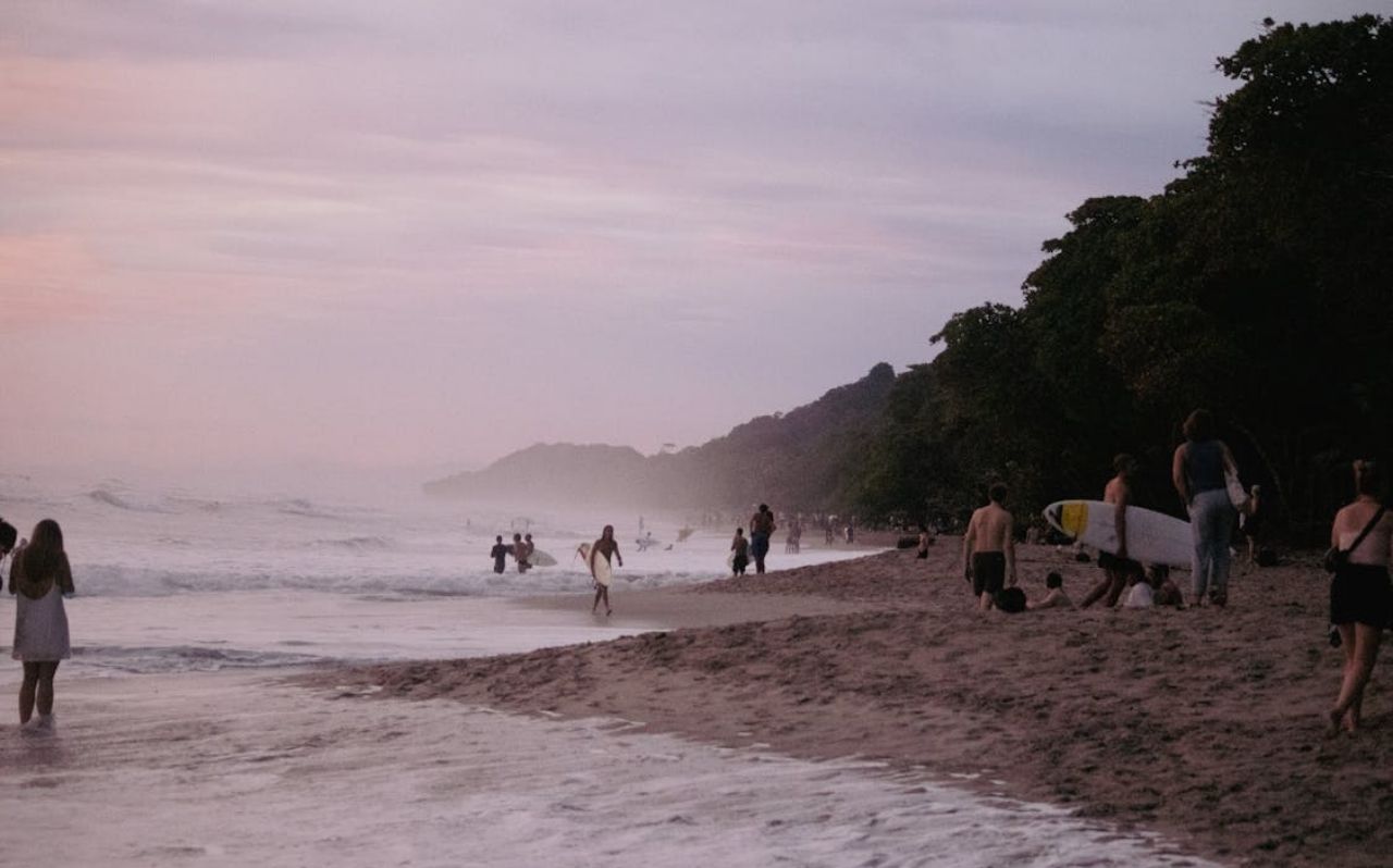 Santa Teresa beach in Costa Rica with dramatic sunset and surf waves