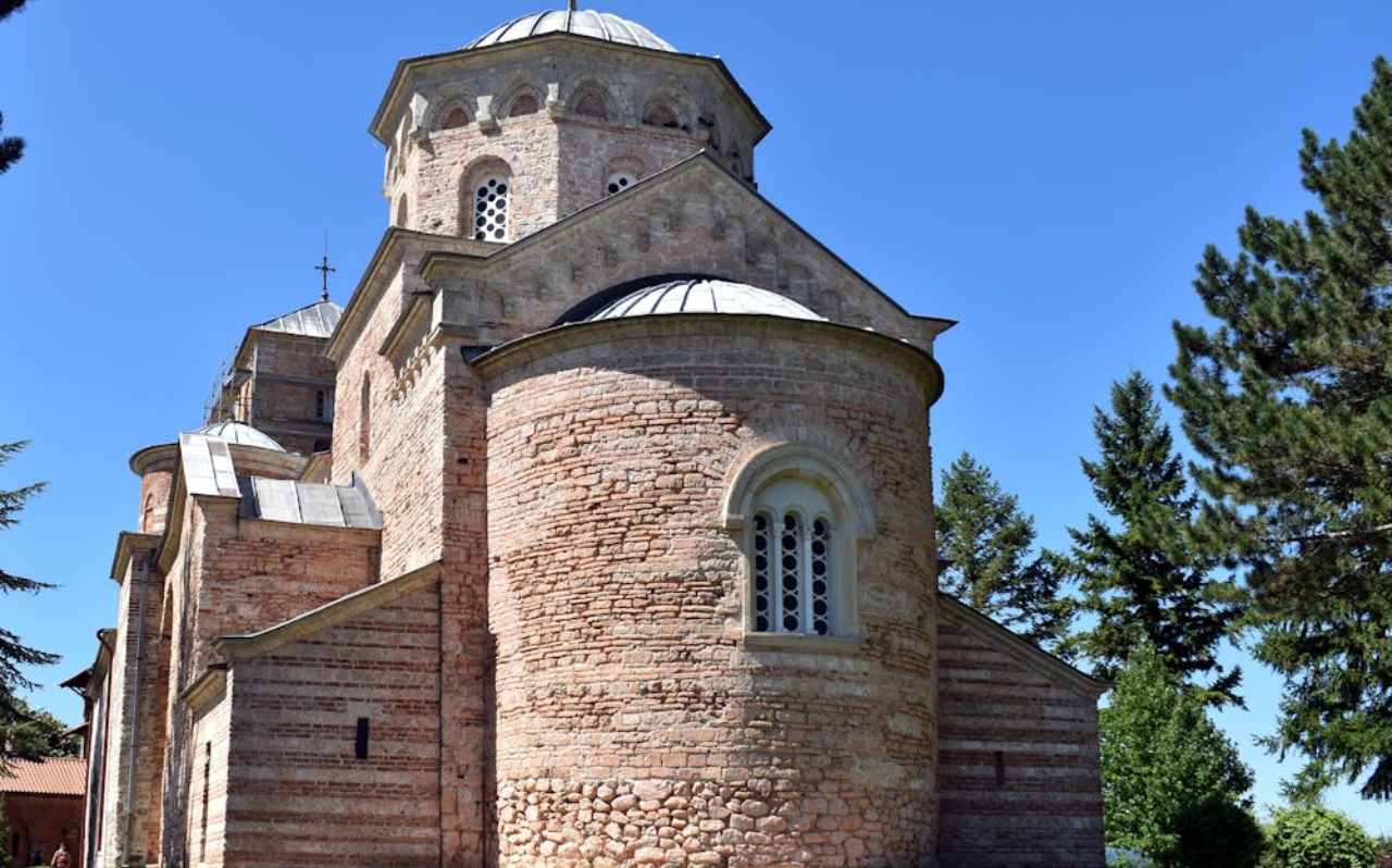 Studenica Monastery courtyard and white marble church in rural Serbia