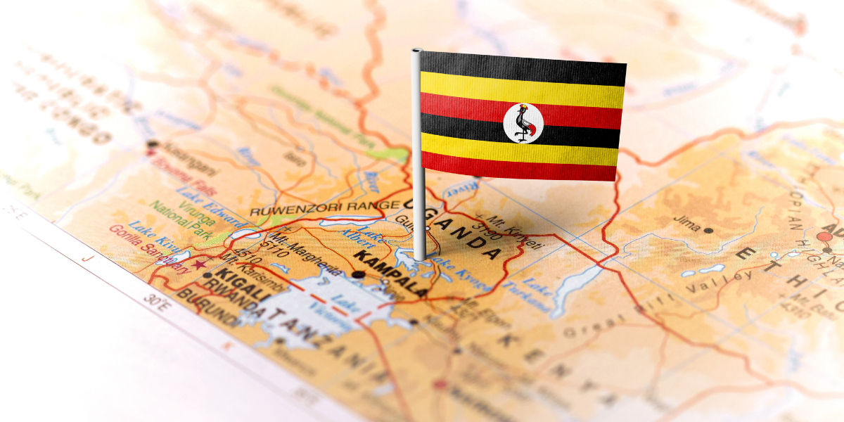 ganda’s national flag pinned on a map highlighting Kampala and surrounding East African countries
